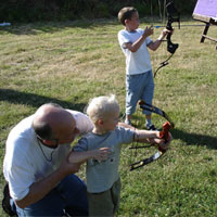 Never to young to start. Chris Jones gives 2 year old Ethan Jones his first lesson.